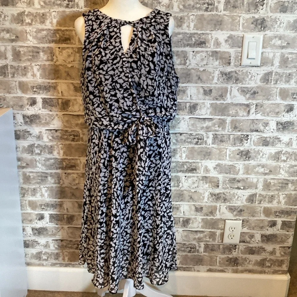 Karin Steven’s sleeveless black/white patterned lined dress. Tie at neck & waist